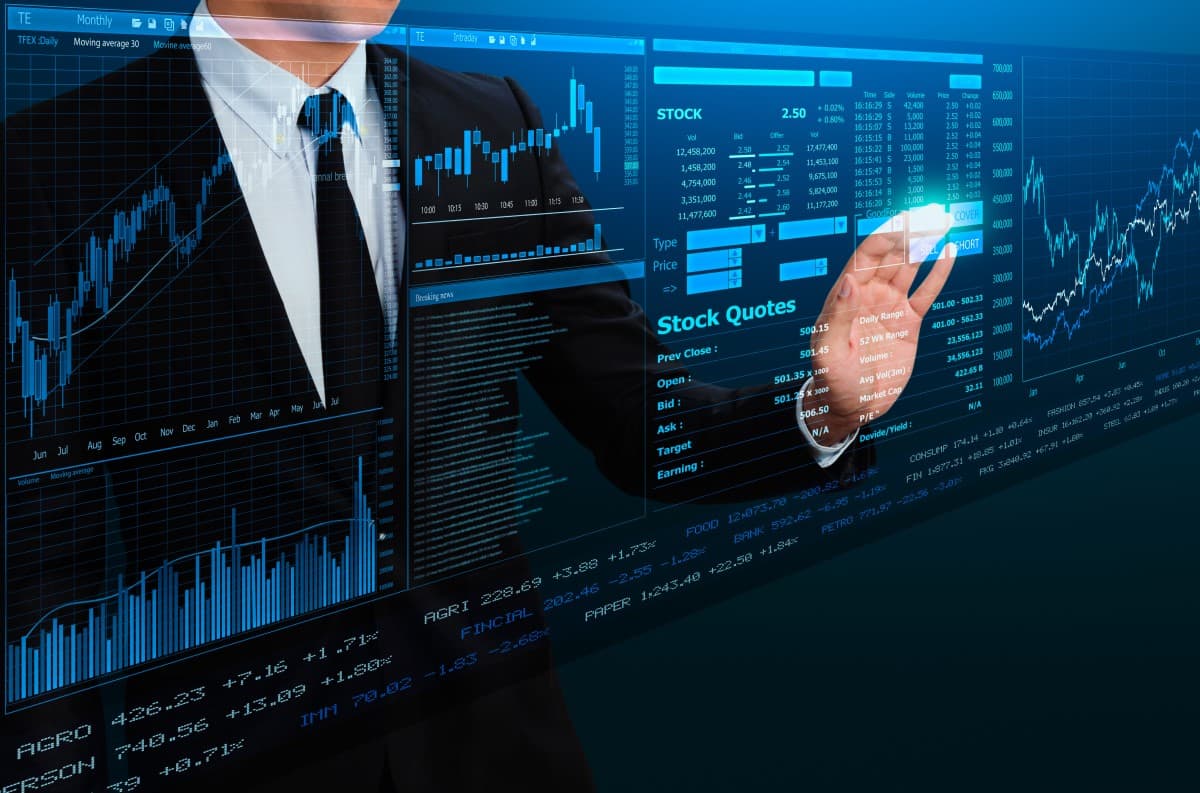 businessman trading stock by futuristic screen