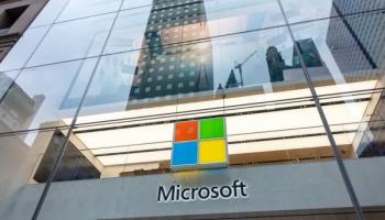 Microsoft Logo in front of high-rise buildings